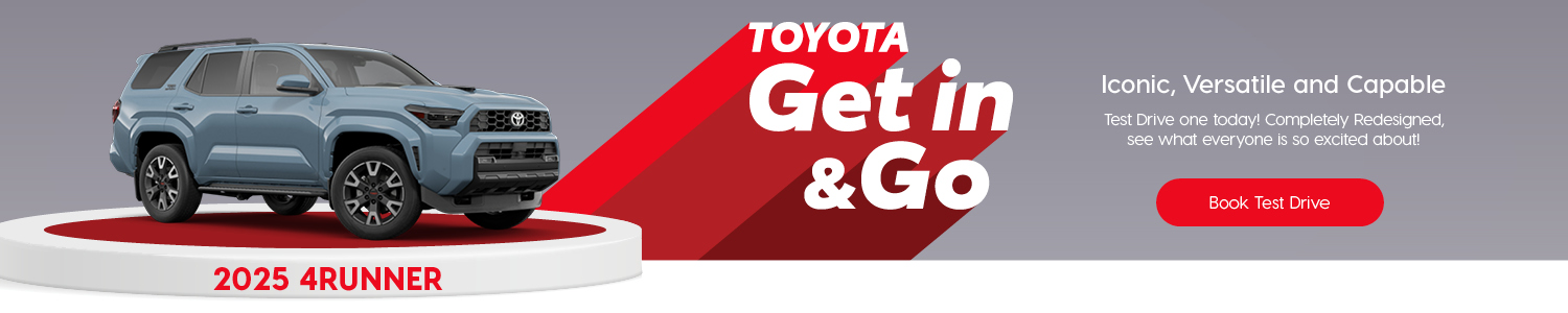 Toyota promotional banner for the 2025 4Runner. The image shows a light blue Toyota 4Runner SUV displayed on a white circular platform with red accents. Large text reads: ‘Toyota Get in & Go.’ Additional text: ‘Iconic, Versatile and Capable. Test drive one today! Completely redesigned, see what everyone is so excited about!’ A red button below says ‘Book Test Drive.’ Background is grey with red graphic elements.